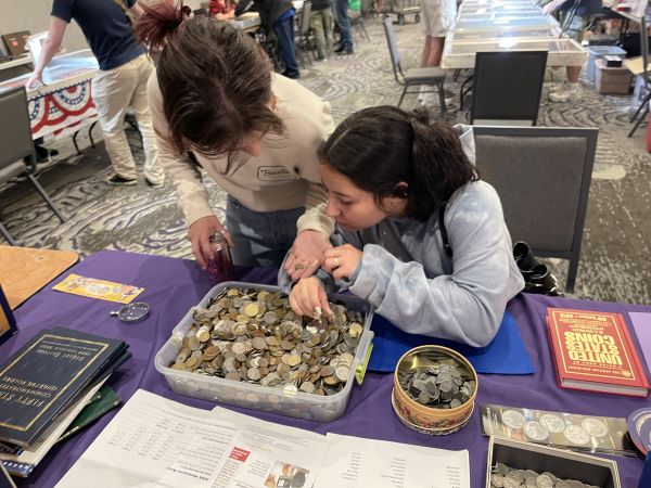 YN's at ILNA table looking at coins